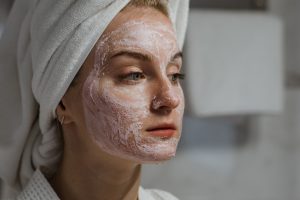 A Woman with Facial Cream on Face