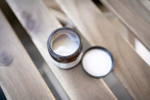 silver ring on brown wooden table